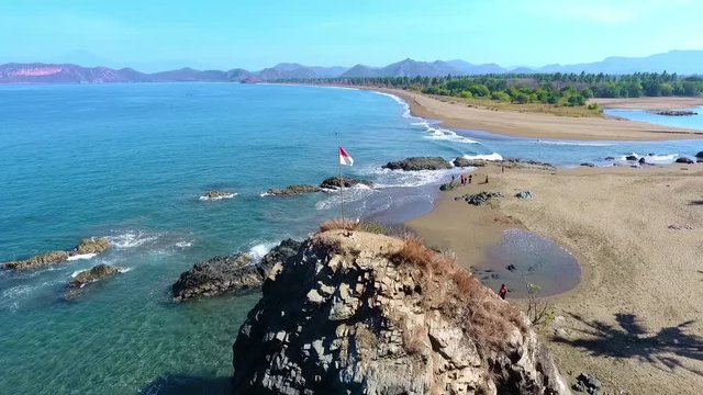 Panning aerial view of the beaches and coast of Poto Batu, West Sumbawa. Indonesia.