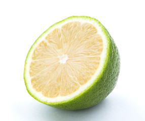 slice of fresh lemon that was cut in half isolated on white background