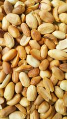 Background of fried peeled pistachios. pistachio nuts without skin. Flatly photo. Vertical footage.