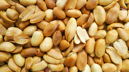 Background of fried peeled pistachios. pistachio nuts without skin. Flatly photo.