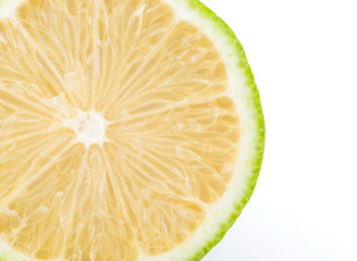 slice of fresh lemon that was cut in half isolated on white background