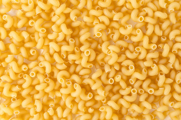 bright yellow pasta spirals, background, texture