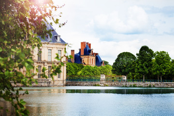 Fototapeta na wymiar Scenic pond view in French king royal Fontainebleau palace, France