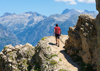 Fototapeta na wymiar Male hiker climbing up a mountain. Active lifestyle concept.