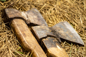 Two old axes on the hay