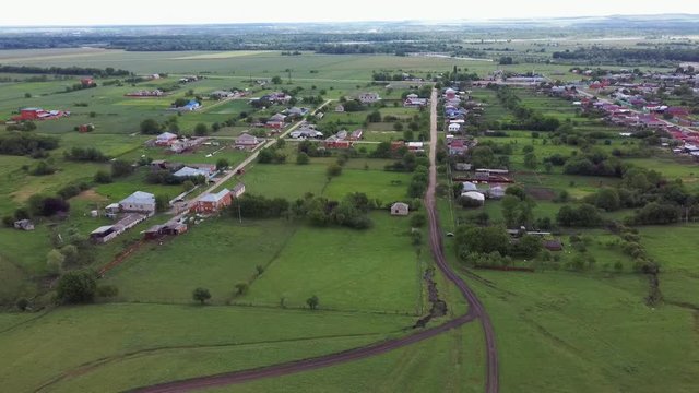 Aerial photography of a village in russia meadows fields mountains aul Khodz