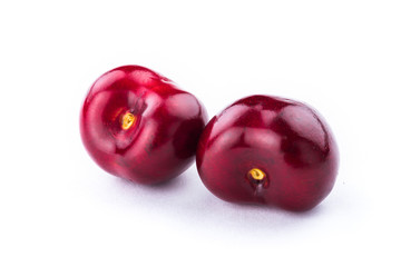 Obraz premium Close-up fresh cherries fruit isolated on white background