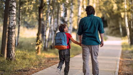 Fototapeta premium Parent and primary school students. beginning lessons.