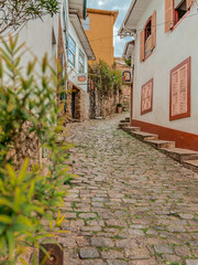 Fototapeta na wymiar narrow street in the colonial baroque rococo town of ouro preto, Brazil