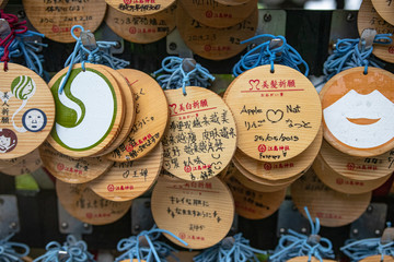 Ema, a row of wooden prayers and wishes in a Japanese temple or shrine 