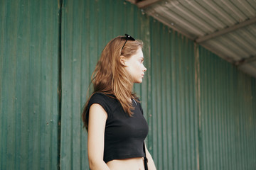 Fototapeta premium Woman in black t-shirt for city street nature model cropped view