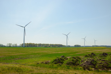 Bright blue sky moving and wind turbine