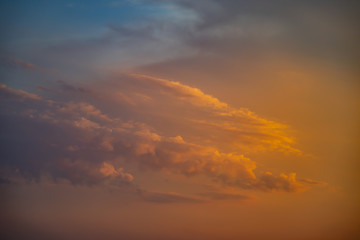 red and orange clouds floating in the sky