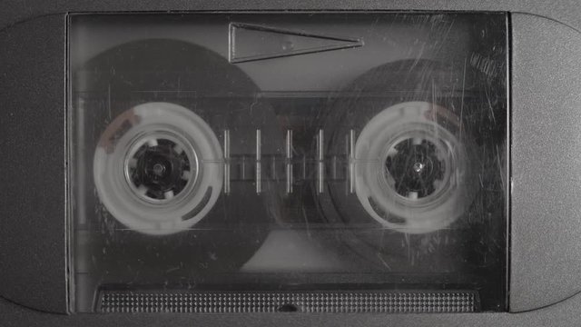 1980's Cassette tape playing and recording on portable retro tape player.