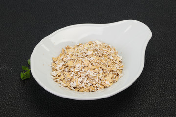 Raw oats in the bowl