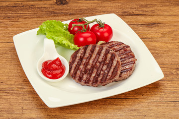 Grilled burger cutlet with sauce
