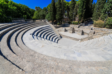 Fototapeta na wymiar Roman Odeon of Kos.Open-air Roman theater, built in the 2nd century, with restored marble seating & galleries.Kos Island, Greece