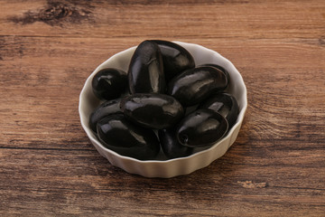 Pickled black olives in the bowl