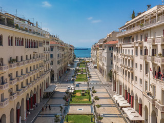 Thessaloniki, Greece aerial drone view of Aristotelous square with less crowd. Day panorama of pedestrian area of central square with low rise traditional buildings on a sunny day.