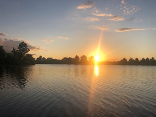 Naklejka premium sunset over the river