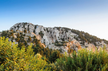 op of the mountain in the rays of the setting sun. Kos Island, Greece