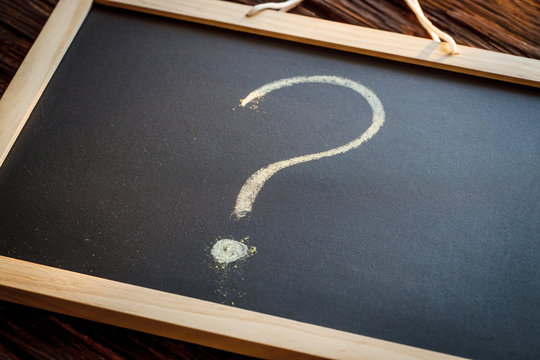 Question mark on a chalkboard. The concept of the unkown about the beginning of the new school year