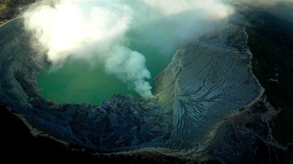 The top view inside a volcano which is erupting in the Java island in Indonesia - obrazy, fototapety, plakaty