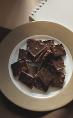 dark chocolate with nuts on the plate