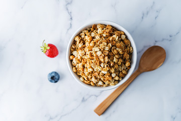Nuts oatmeal granola with berries in a bowl
