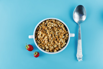 Nuts oatmeal granola with berries in a bowl