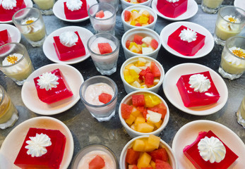 Variety mix of the dessert (fruit salad, jelly, coffee panna cotta, strawberry yogurt).