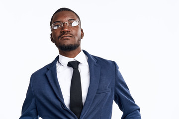 portrait of a handsome man of African appearance in a suit on a light background cropped view close-up model