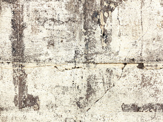 Fototapeta premium Background concrete wall, traces of weathering, worn wall damaged paint old paint. Remains of old paint on the painted concrete surface. Grungy concrete surface.
