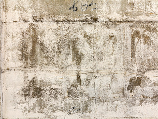 Background concrete wall, traces of weathering, worn wall damaged paint old paint. Remains of old paint on the painted concrete surface. Grungy concrete surface.