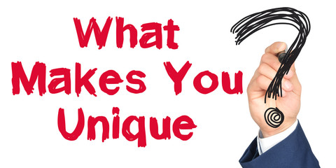Hand with marker writing: What Makes You Unique