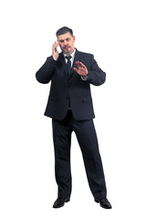 Obraz premium Man businessman in a suit talking on a cell phone