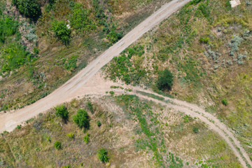 Countryside rural dirt road. Aerial view.