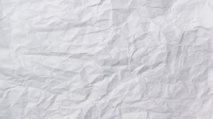 White crumpled paper background texture. Stop motion animation. Seamless looping.