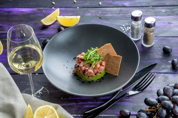 beef tartare on a pillow of mashed spinach
