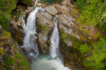 Aerial Drone View Of Nooksack Falls, Washington. Nooksack Falls is one of the most popular waterfalls in the North Cascades. Most accounts place the height at 170 feet.
