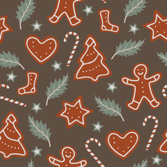 Christmas seamless pattern with candy canes, gingerbreads and leafs. Repetitive vector pattern design.