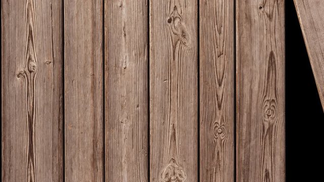 A background of unpainted wooden planks is assembled one by one.