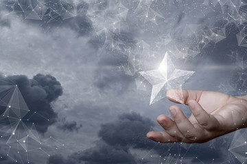 The hand shows a hologram of the stars emerging from the network .