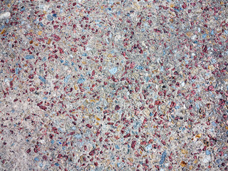 textured background concrete surfaces interspersed with small stones