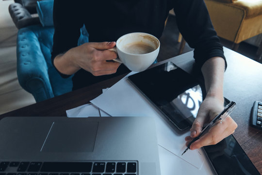 Workplace documents mobile phone laptop tablet coffee cup worker office. - Powered by Adobe