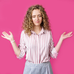 Portrait of a woman who holds her hands up, palms up.