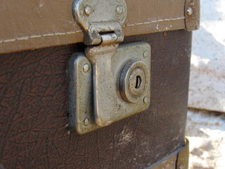 Old vintage suitcase with chrome lock