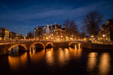 Fototapeta na wymiar Amsterdam canal at twilight in winter, Amsterdam is the capital and most populous city in Netherlands.