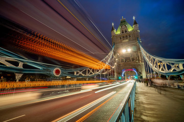 Fototapeta na wymiar Tower Bridge and traffic light at twilight in London, UK