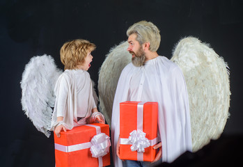 Valentines angels. Valentines day. Cute angel. Father and son Angels. Little cupid boy gives father...